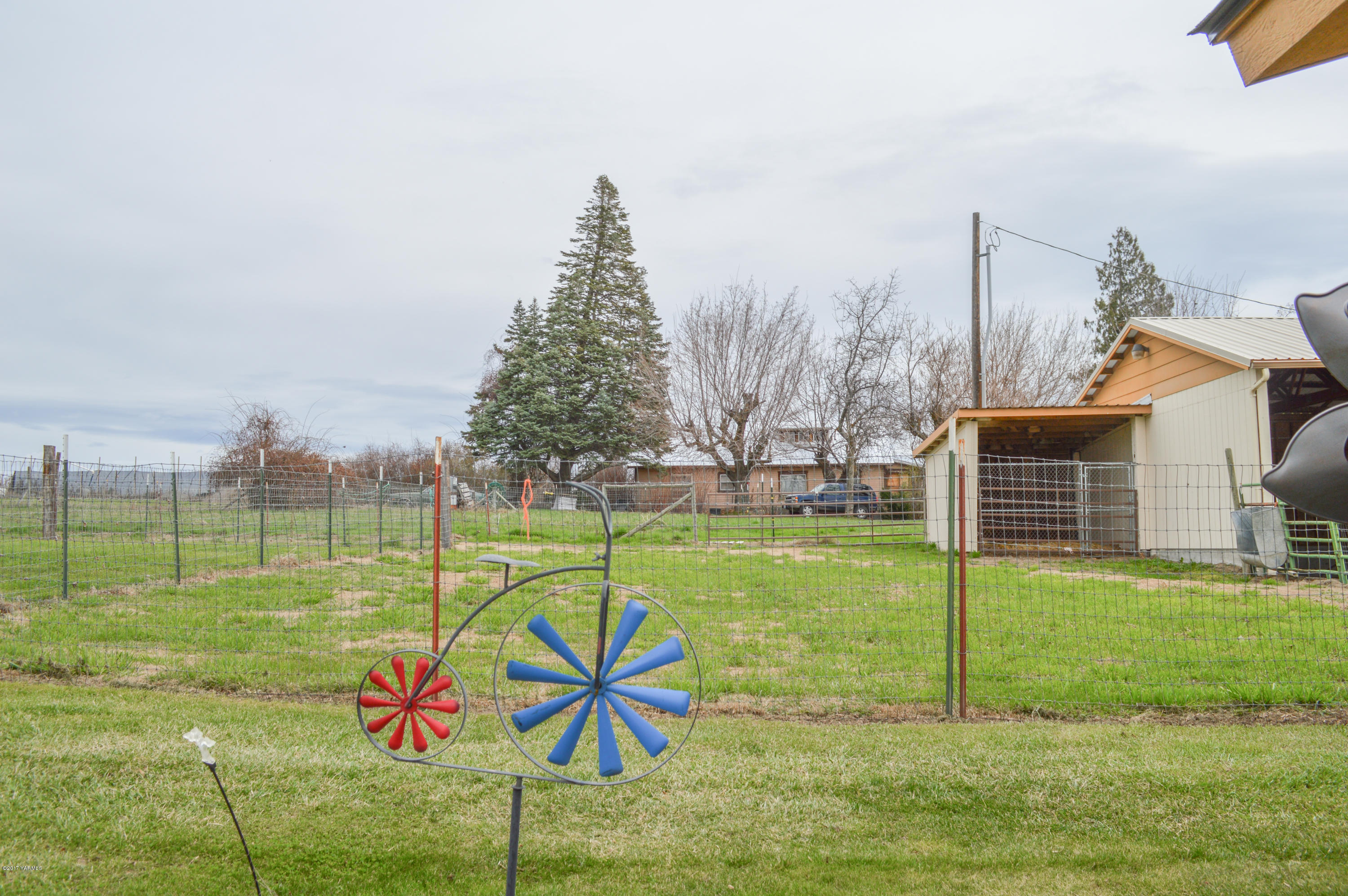 581 Gilbert Road Zillah, WA 98953 - Photo 23 of 38 a view of a playground with basketball court