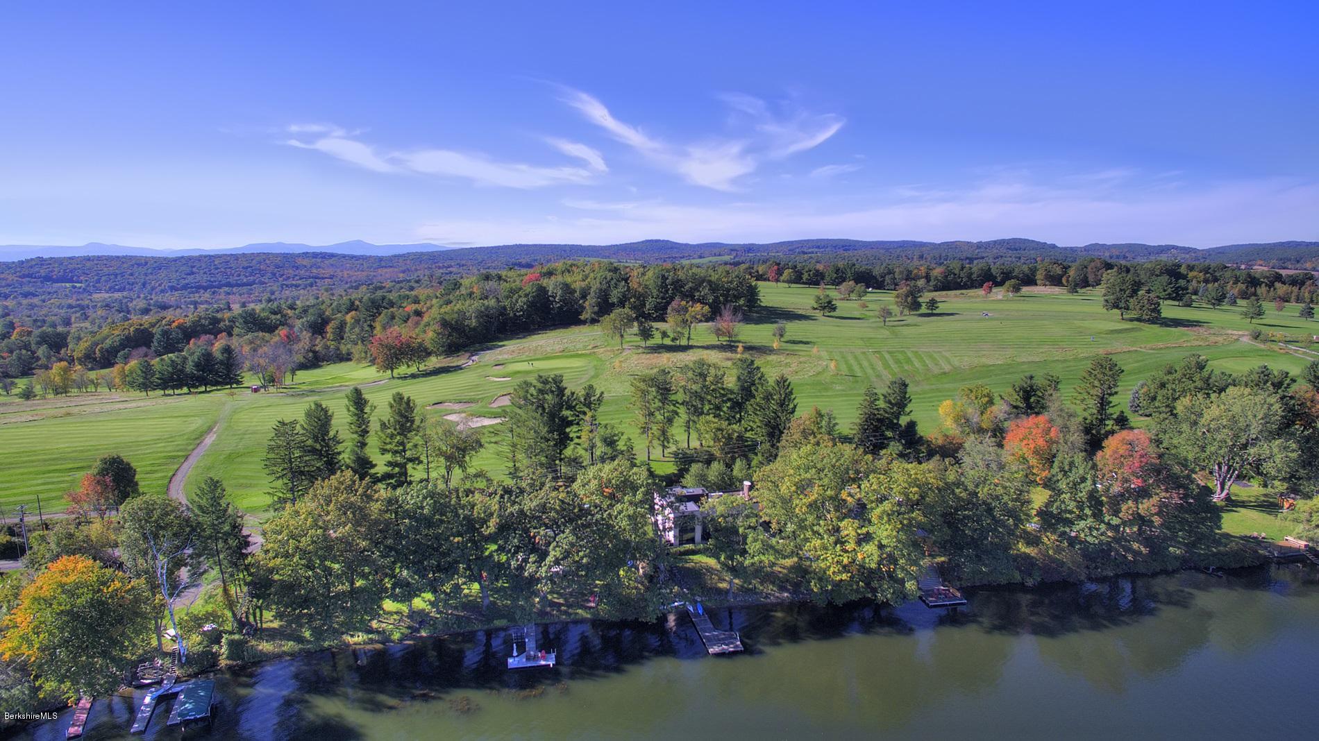 121 A Golf Course Road Craryville, NY 12521 - Photo 4 of 19 a view of a lake with a mountain in the background