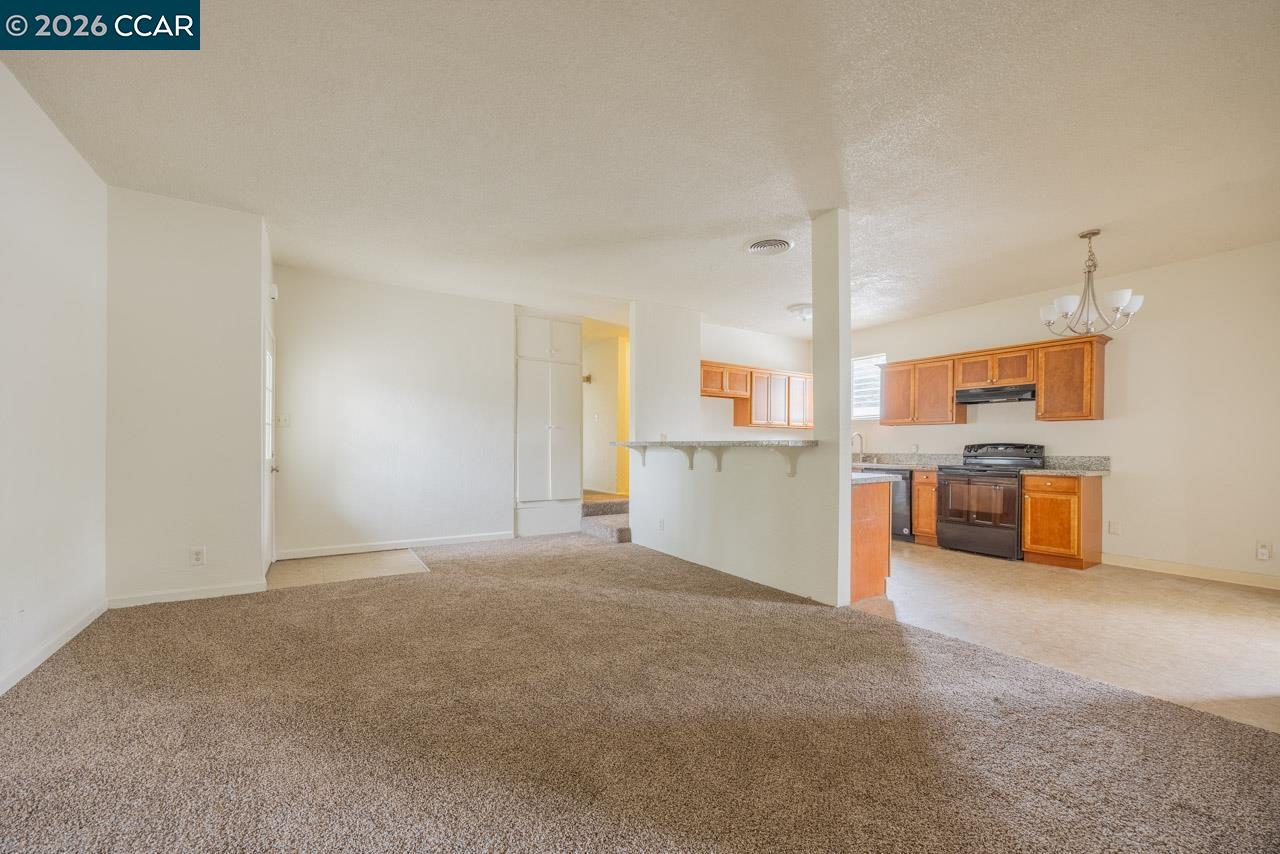 6118 Rutland Drive Carmichael, CA 95608 - Photo 8 of 19 a view of a kitchen with refrigerator and a sink