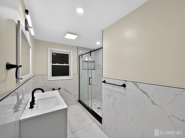 a bathroom with a sink and mirror