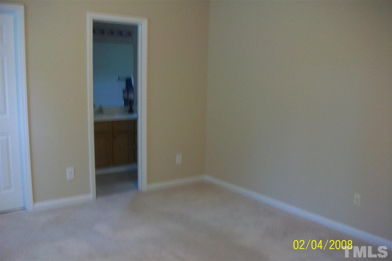 5629 Lighthall Lane Raleigh, NC 27604 - Photo 11 of 13 Looking from generous sized master bedroom into master bath/spa and walk-in closet.