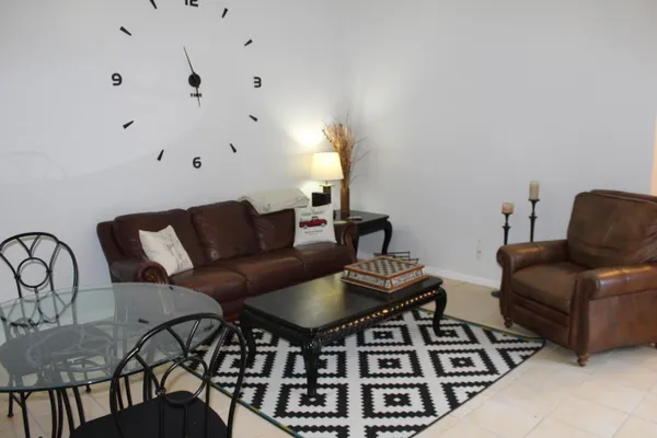 a view of a workspace with furniture