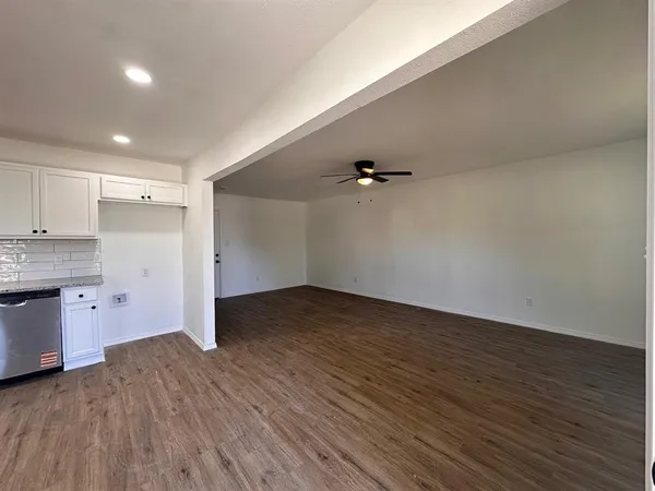 a view of a kitchen with a microwave and stove