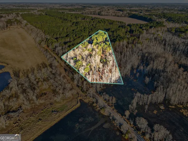a view of swimming pool with a yard and lake view