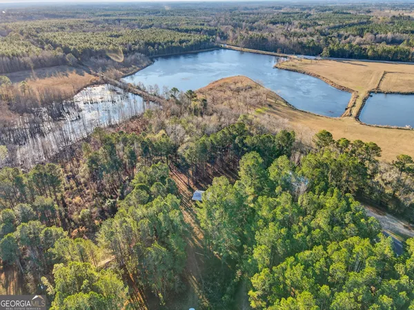 an aerial view of a house with a lake view