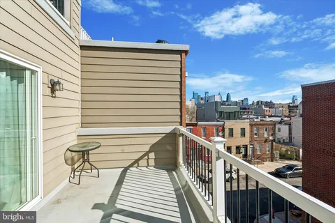a view of a balcony with furniture