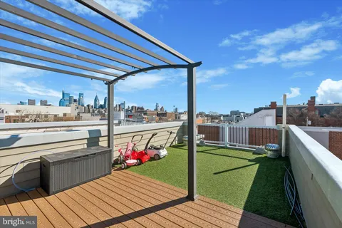 a view of a balcony with wooden floor