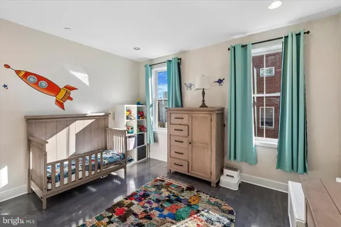 a bedroom with furniture and a dresser