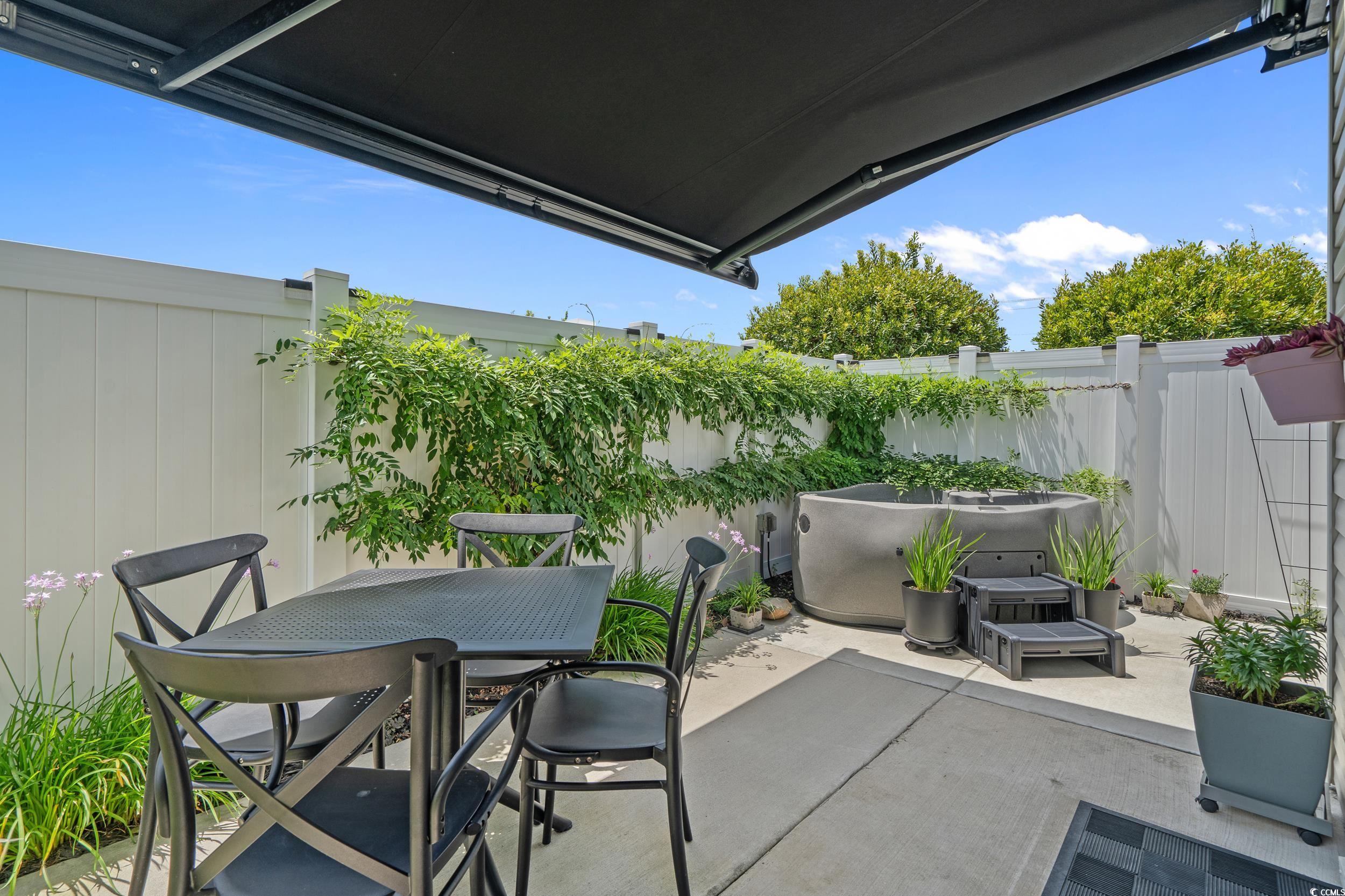 752 Hobonny Loop Longs, SC 29568 - Photo 31 of 40 Fenced backyard featuring a patio and outdoor dining space