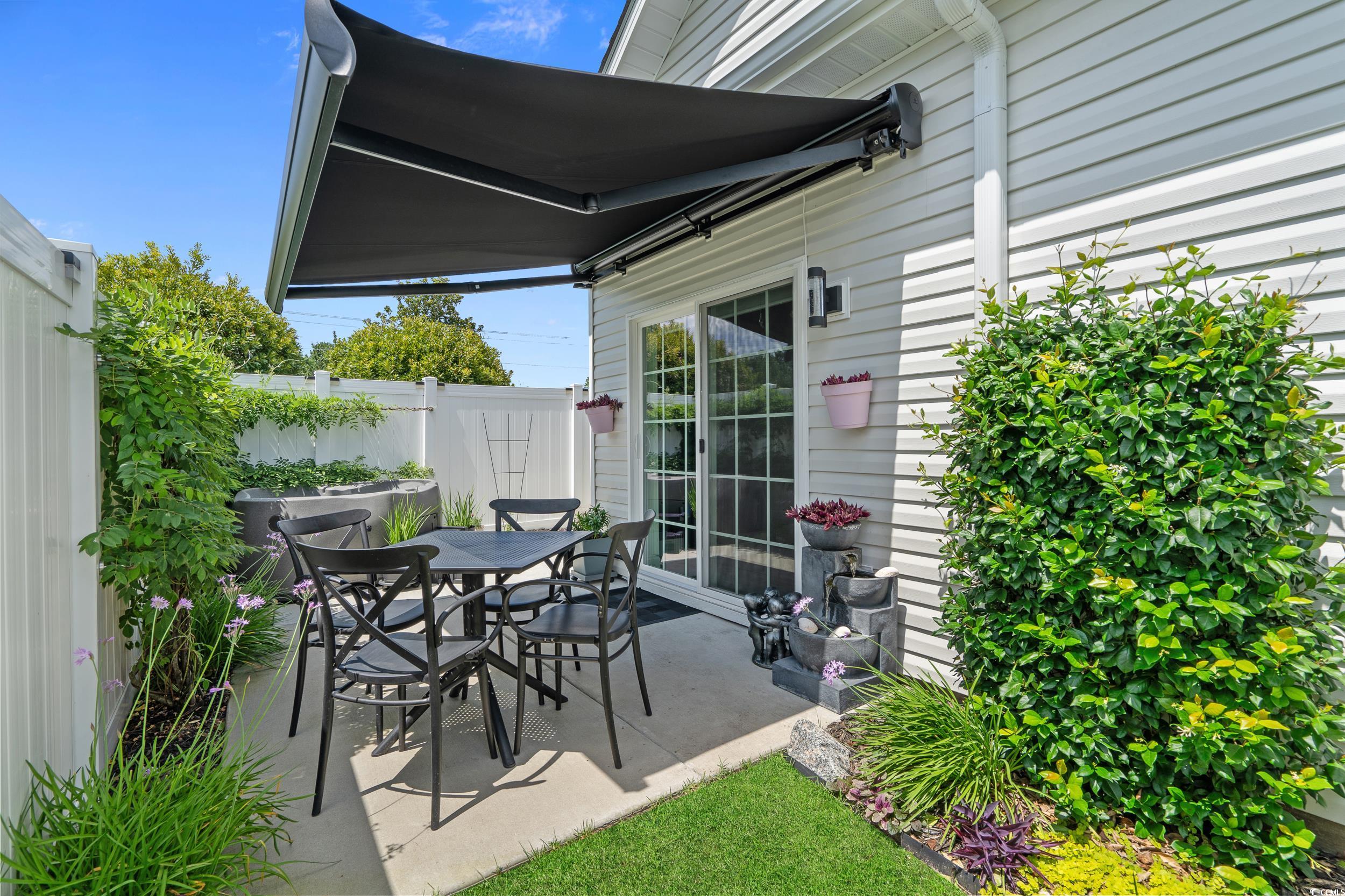 752 Hobonny Loop Longs, SC 29568 - Photo 35 of 40 View of patio with outdoor dining space