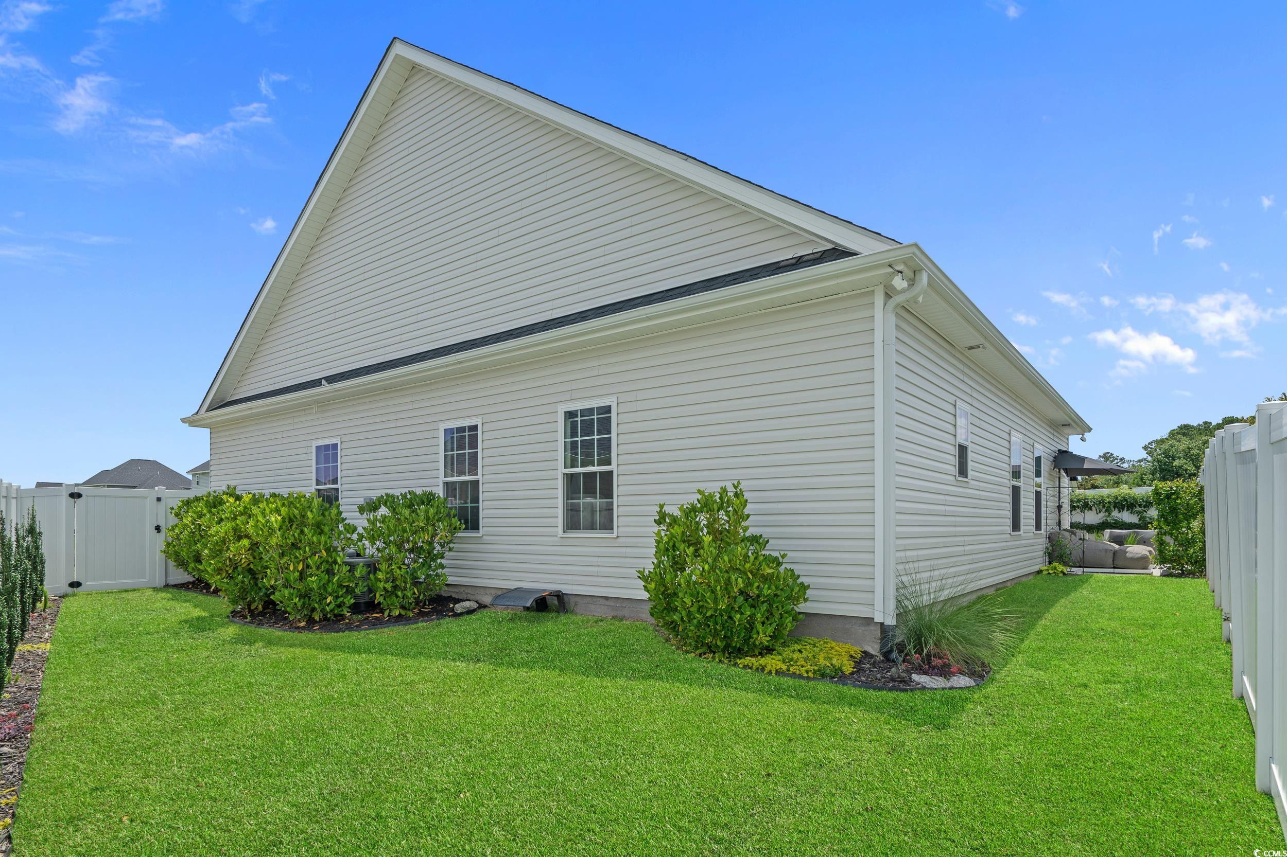 752 Hobonny Loop Longs, SC 29568 - Photo 36 of 40 View of home's exterior with a gate and a fenced backyard
