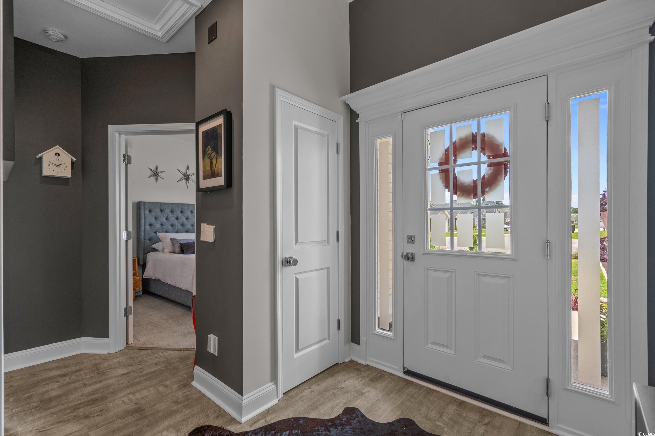 752 Hobonny Loop Longs, SC 29568 - Photo 4 of 40 Foyer entrance featuring light wood-style floors and baseboards