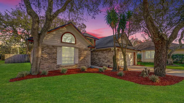 a front view of a house with garden