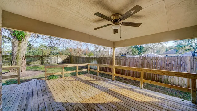 a view of a balcony with wooden floor