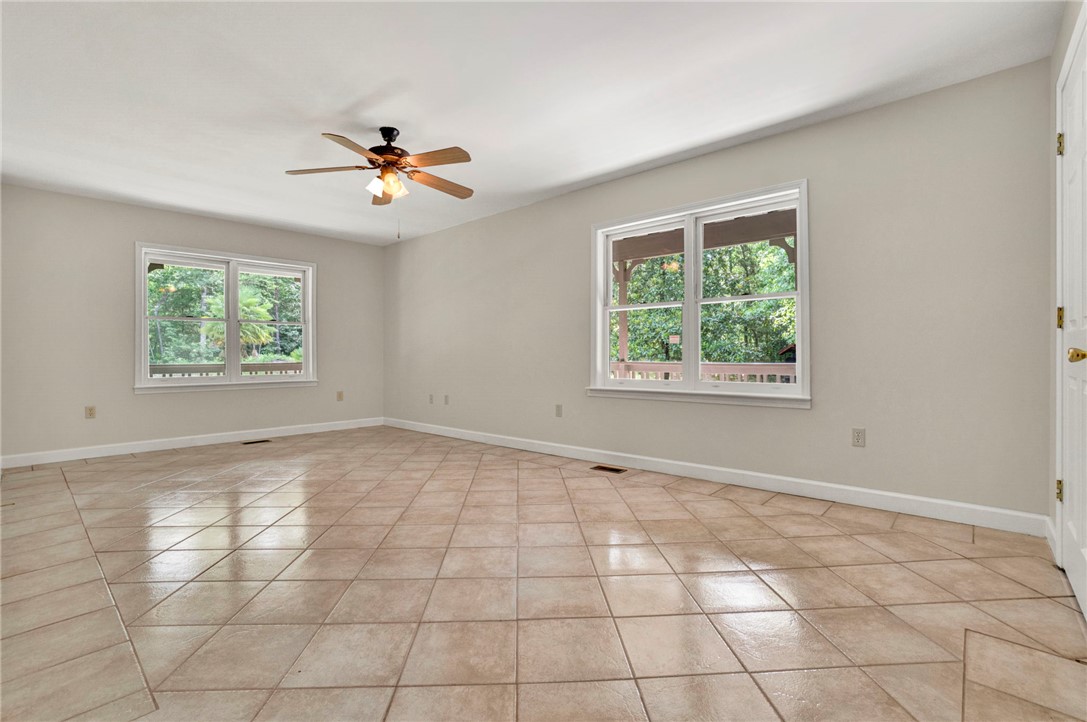 120 Patterson Ridge Road Salem, SC 29676 - Photo 5 of 46 A versatile living space with light tile flooring and verdant views from large windows.