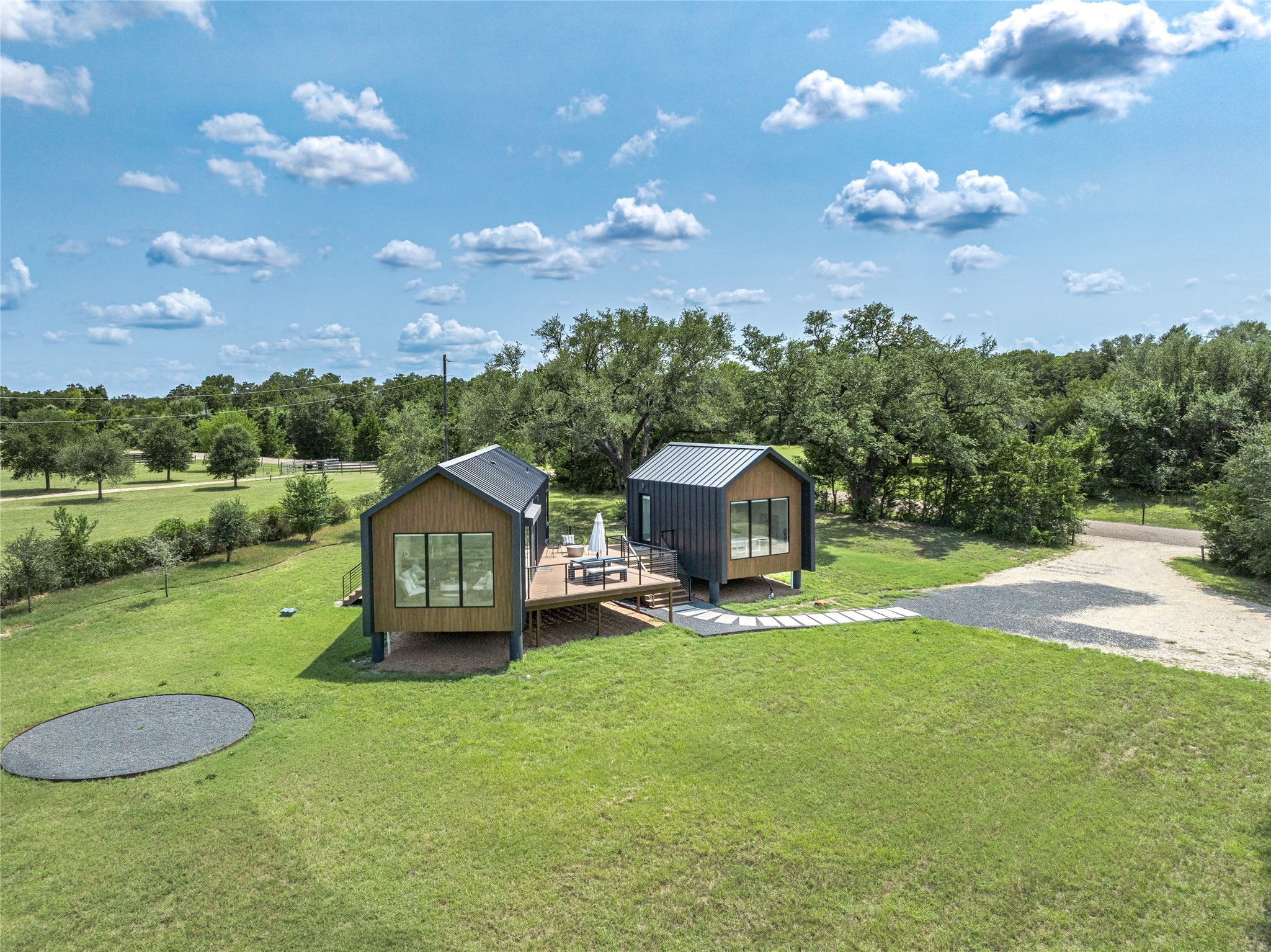 8390 Schuster Road Ledbetter, TX 78946 - Photo 19 of 27 a view of a garden with a house in the background