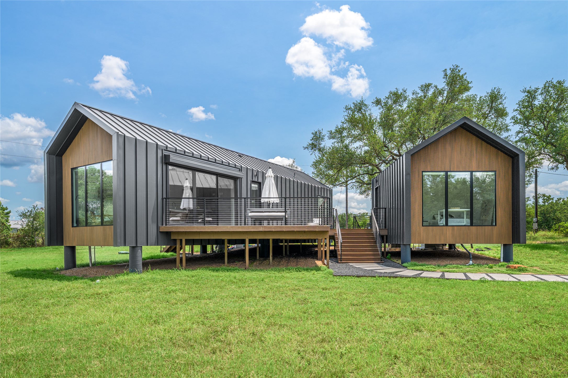 8390 Schuster Road Ledbetter, TX 78946 - Photo 2 of 27 a view of a house with backyard and porch