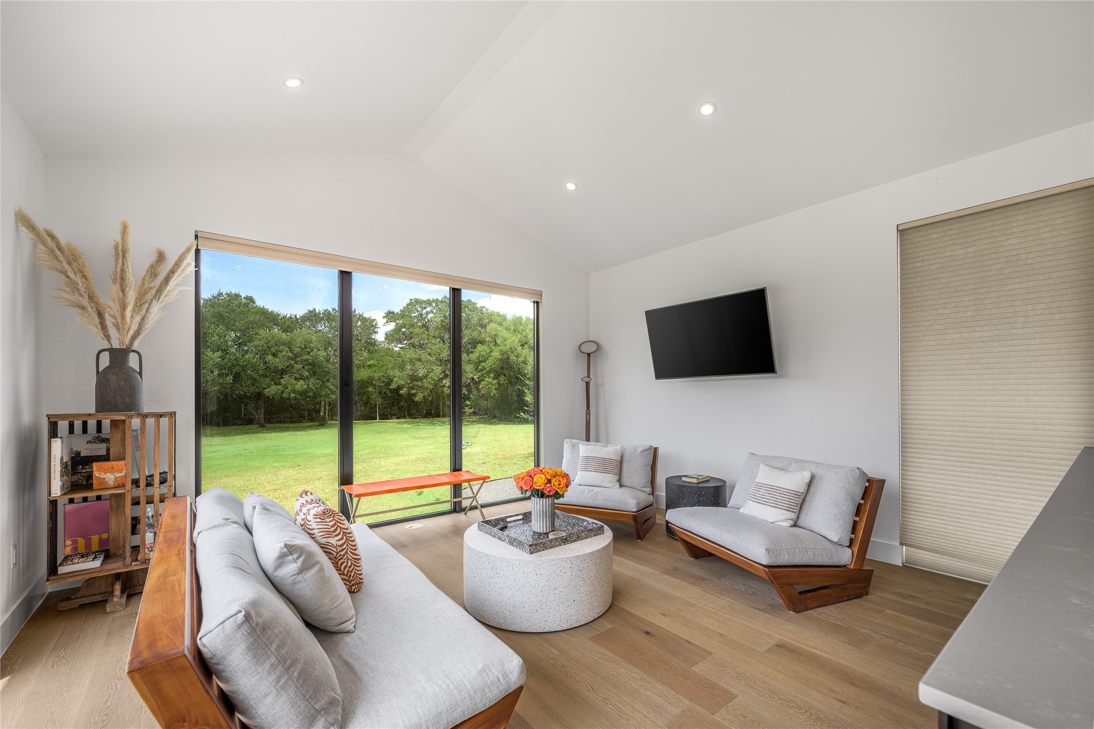 8390 Schuster Road Ledbetter, TX 78946 - Photo 3 of 27 a living room with furniture and a flat screen tv