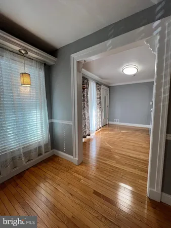 a spacious bathroom with a granite countertop sink and a large mirror