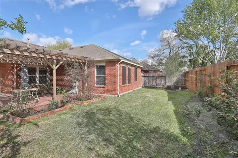 a view of a backyard of the house
