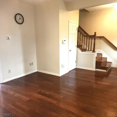 a view of a livingroom with wooden floor
