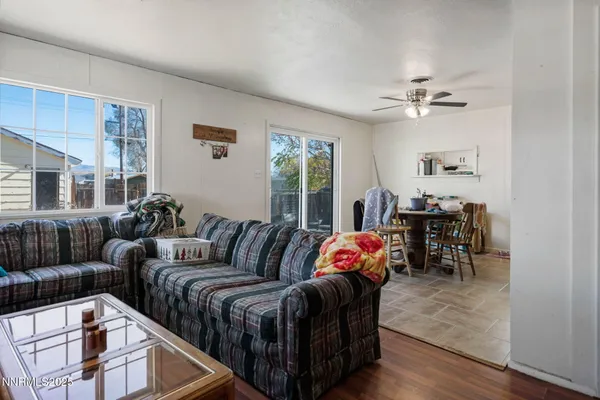 a bedroom with furniture and wooden floor