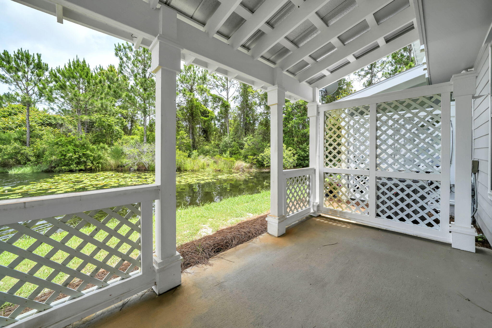 159 Golden Eagle Court, Unit 3C Santa Rosa Beach, FL 32459 - Photo 18 of 34 a view of a porch with chairs and trees