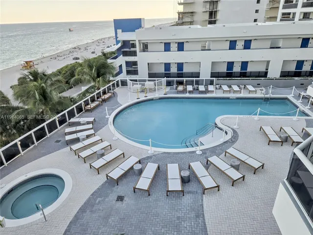 a view of a balcony with chairs and a table