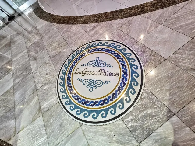 a lobby with furniture and a potted plant