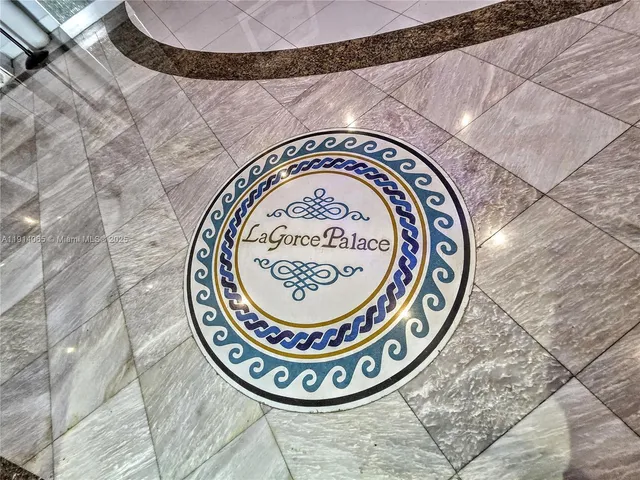 a lobby with furniture and a potted plant