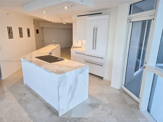 a living room with sink and mirror