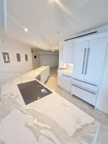 a bathroom with a sink a mirror and a bathtub