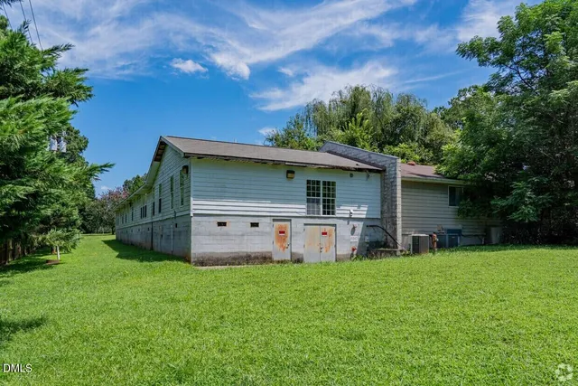 a room with pool table and a chandelier