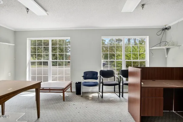 a room with a bed and a chandelier