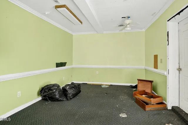 a room with a bed and a dresser