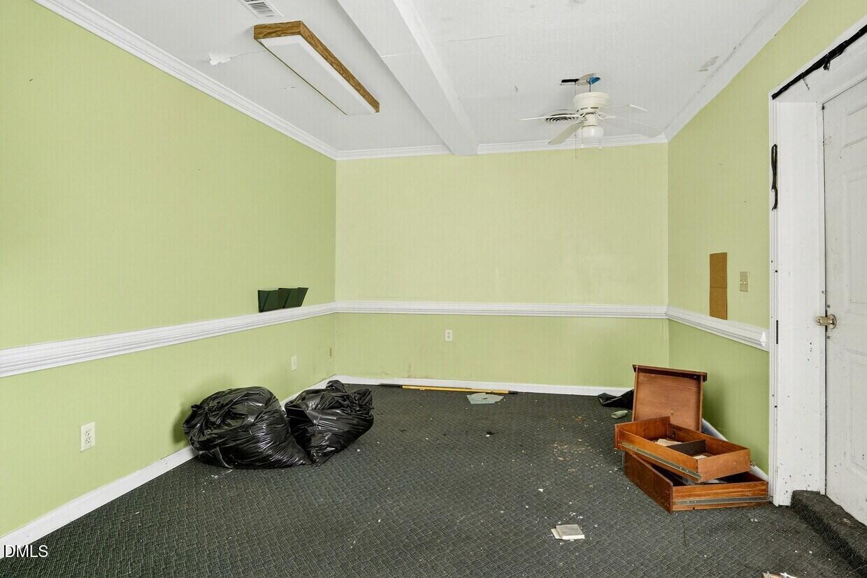 306 South Allen Road Wake Forest, NC 27587 - Photo 19 of 48 a room with a bed and a chandelier