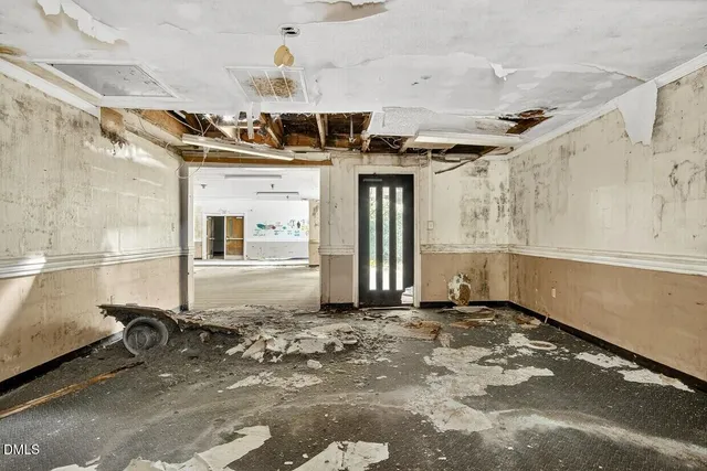 a living room with furniture and window