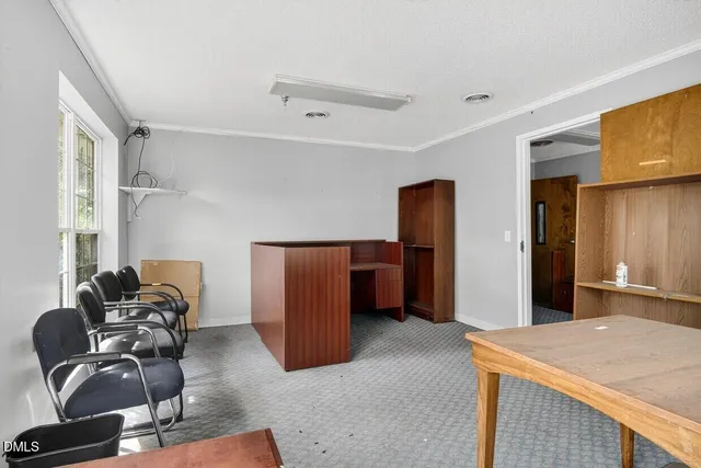 a big room with closet and windows