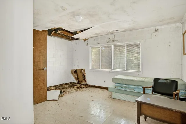 a kitchen with a stove a refrigerator and cabinets