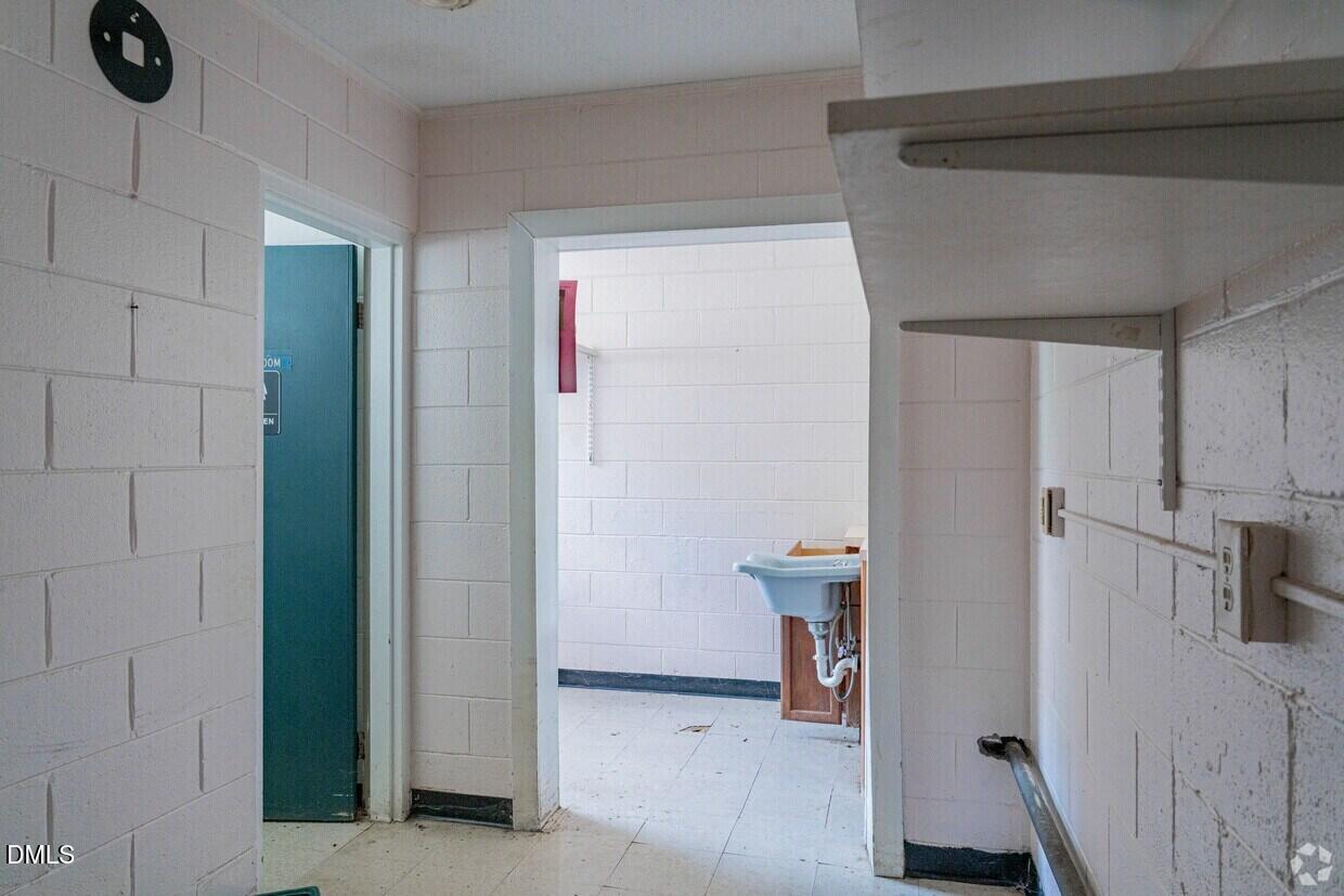 306 South Allen Road Wake Forest, NC 27587 - Photo 40 of 48 a view of hallway with furniture and a refrigerator