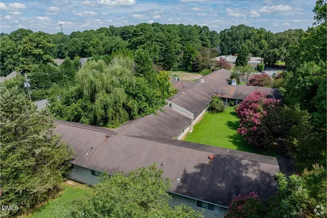an aerial view of a house with a yard