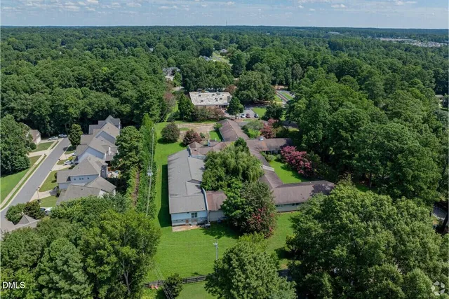 a house with trees in the background