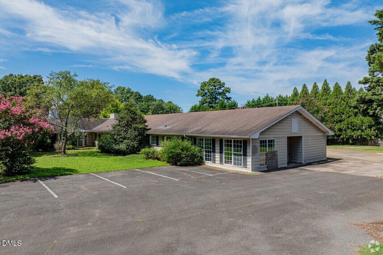 306 South Allen Road Wake Forest, NC 27587 - Photo 6 of 48 a house with trees in the background
