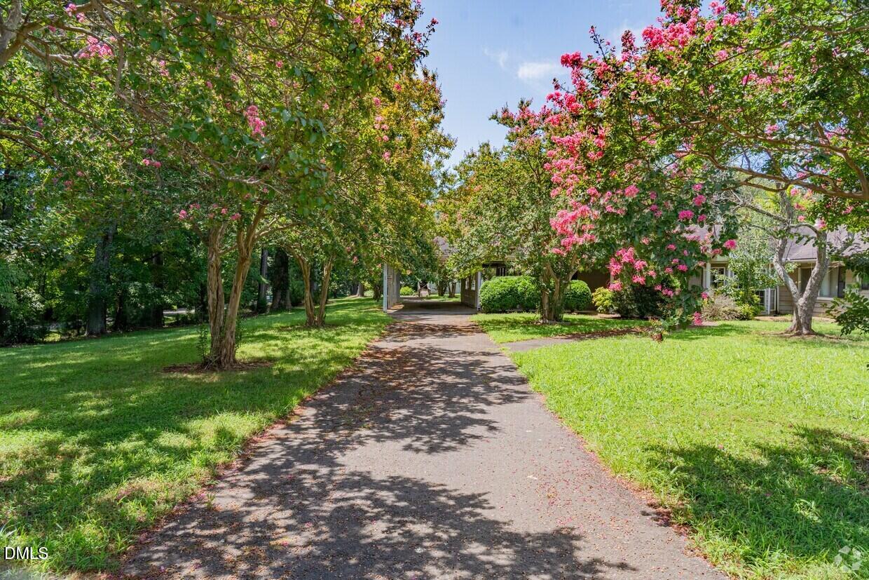 306 South Allen Road Wake Forest, NC 27587 - Photo 7 of 48 a green field with flowers and trees