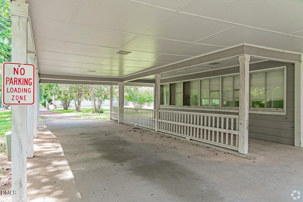 306 South Allen Road Wake Forest, NC 27587 - Photo 9 of 48 a view of a porch with wooden floor and fence