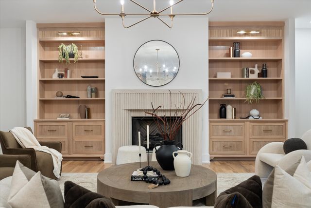 a living room with furniture a window and a fireplace