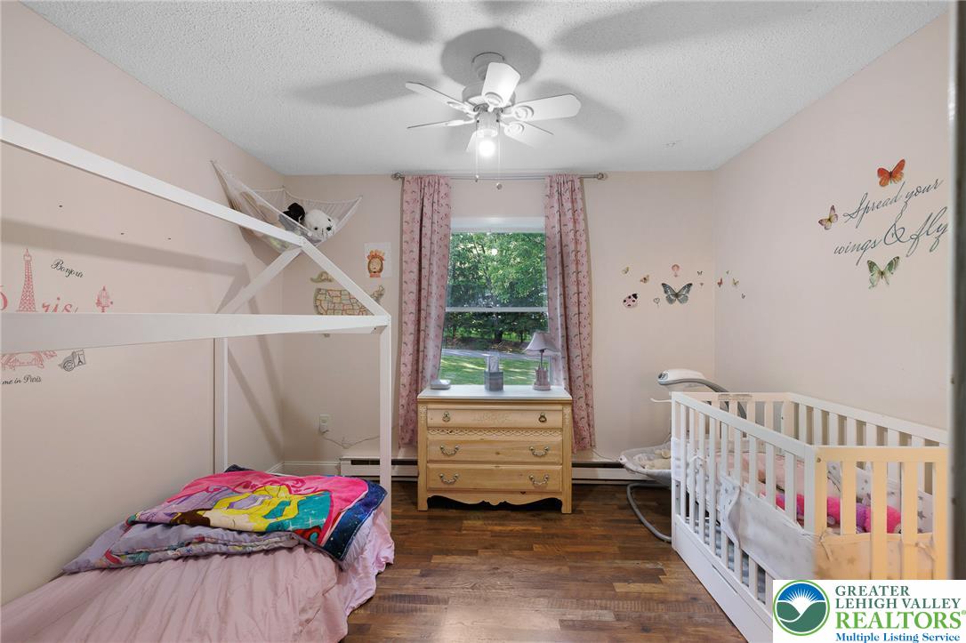 256 Sundance Road Effort, PA 18330 - Photo 45 of 83 a bedroom with furniture and a baby crib
