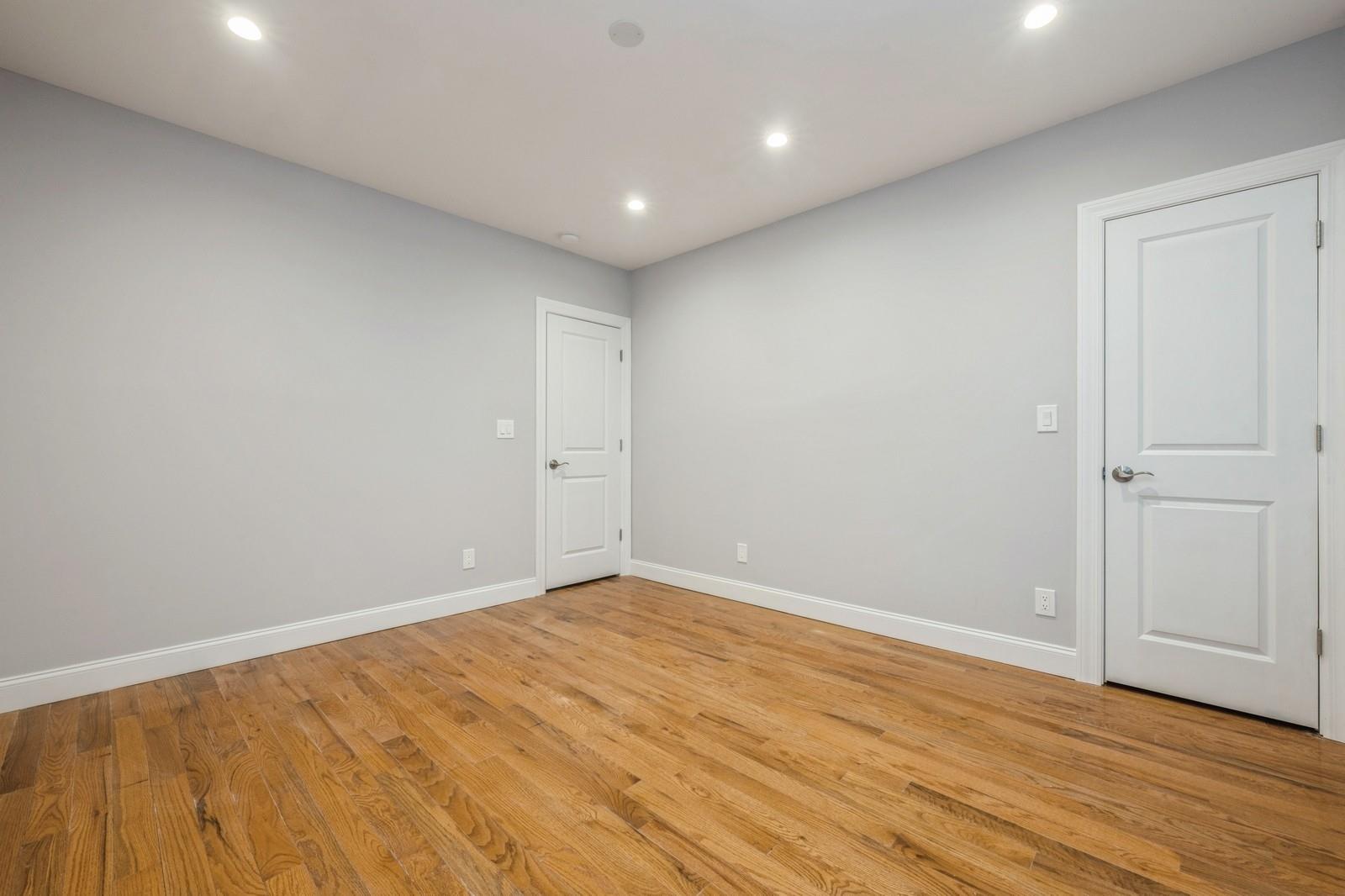 246-59 86th Road Queens, NY 11426 - Photo 21 of 44 Spare room with light wood-type flooring