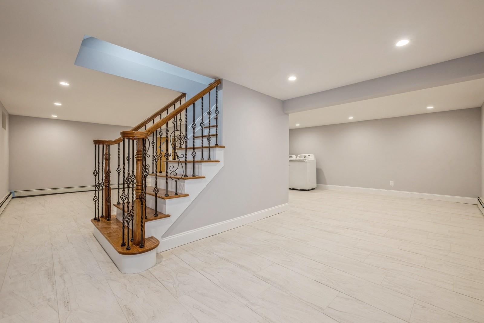 246-59 86th Road Queens, NY 11426 - Photo 34 of 44 Staircase with washer / clothes dryer