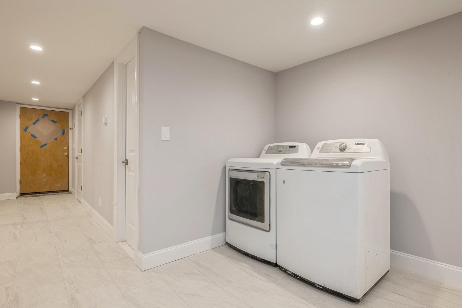 246-59 86th Road Queens, NY 11426 - Photo 36 of 44 Washroom with washing machine and dryer